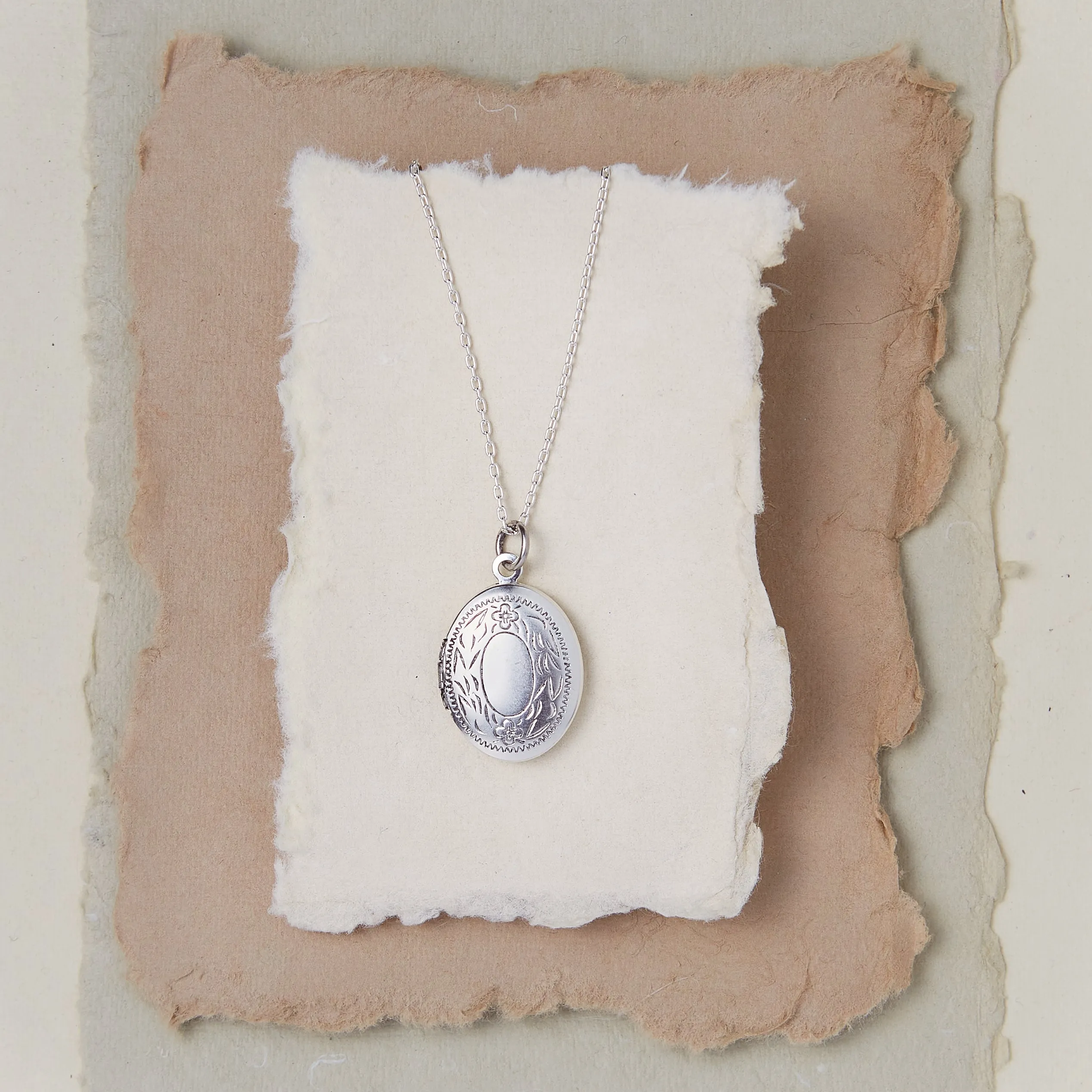 Oval Locket With Leaf Border