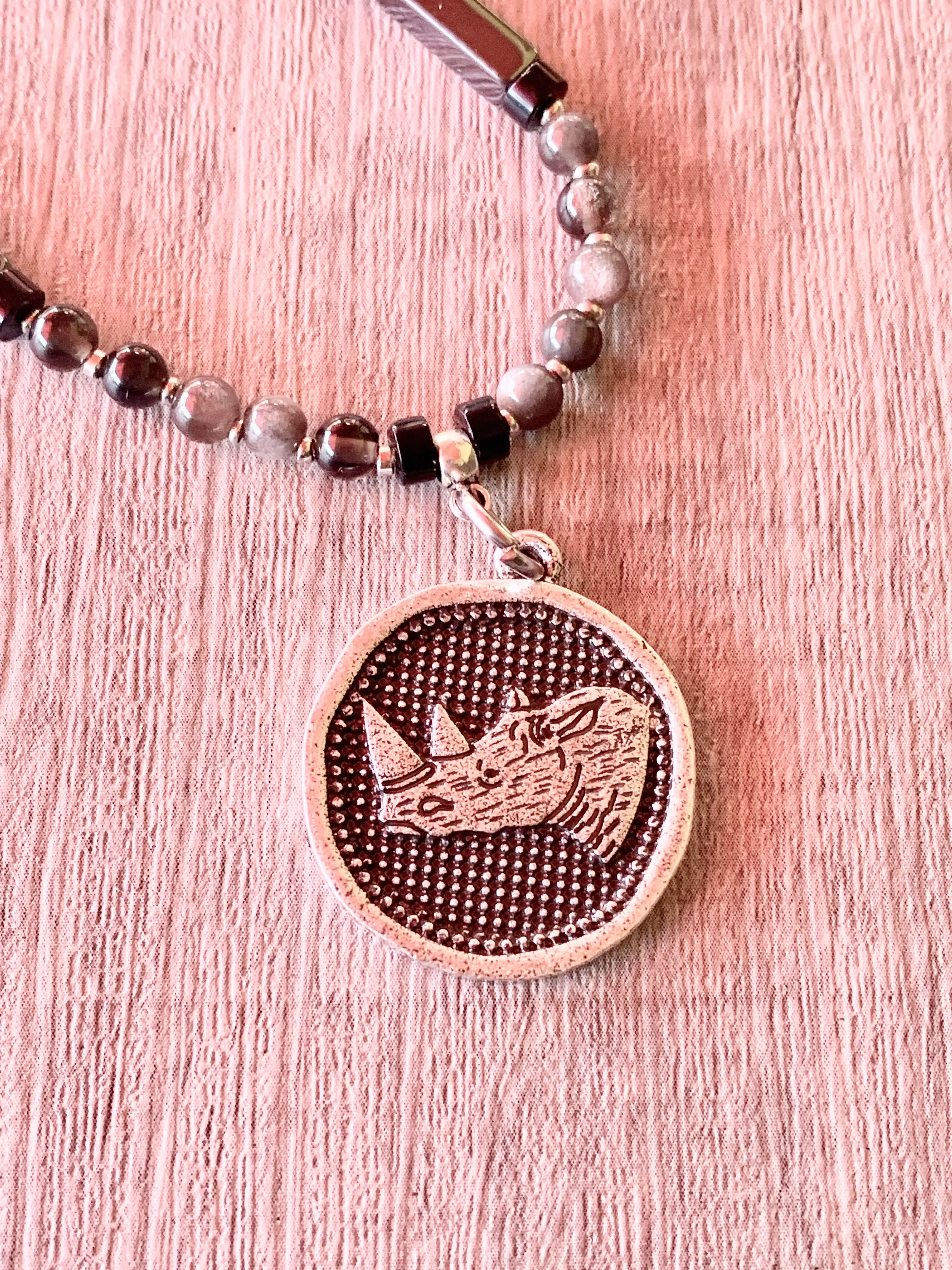 Sudan Handmade Silver Obsidian, Hematite, and Black Quartz 29" Necklace with Rhino Coin Pendant